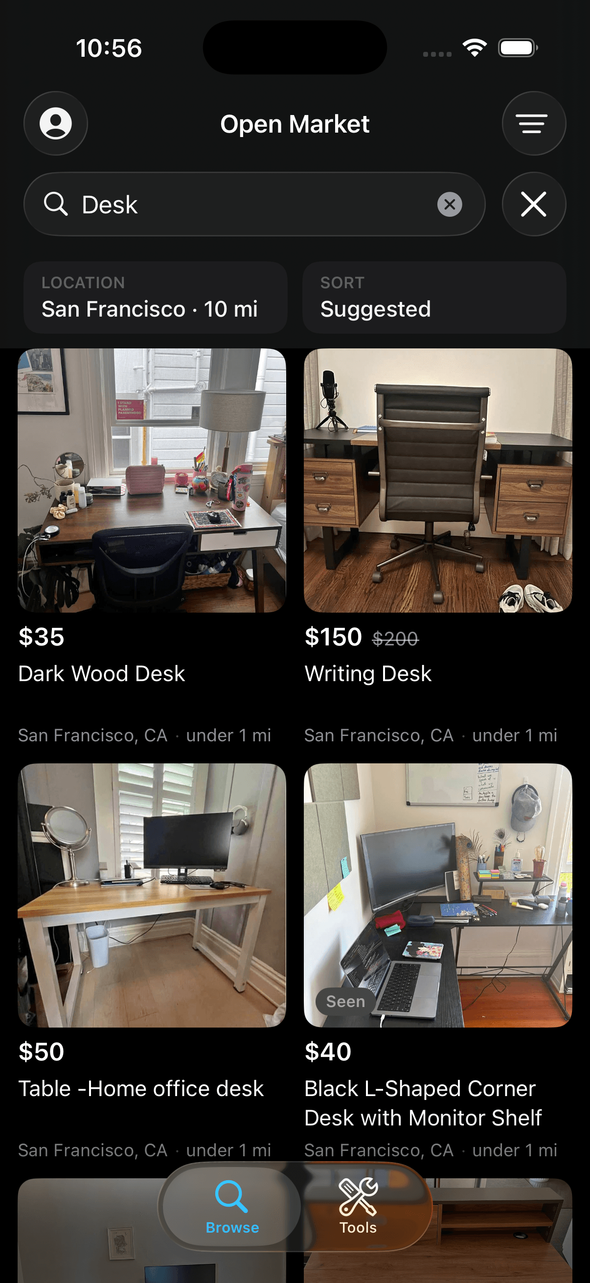 Openmarket search results for “desk” showing the price, a price drop, and the city and distance on every card